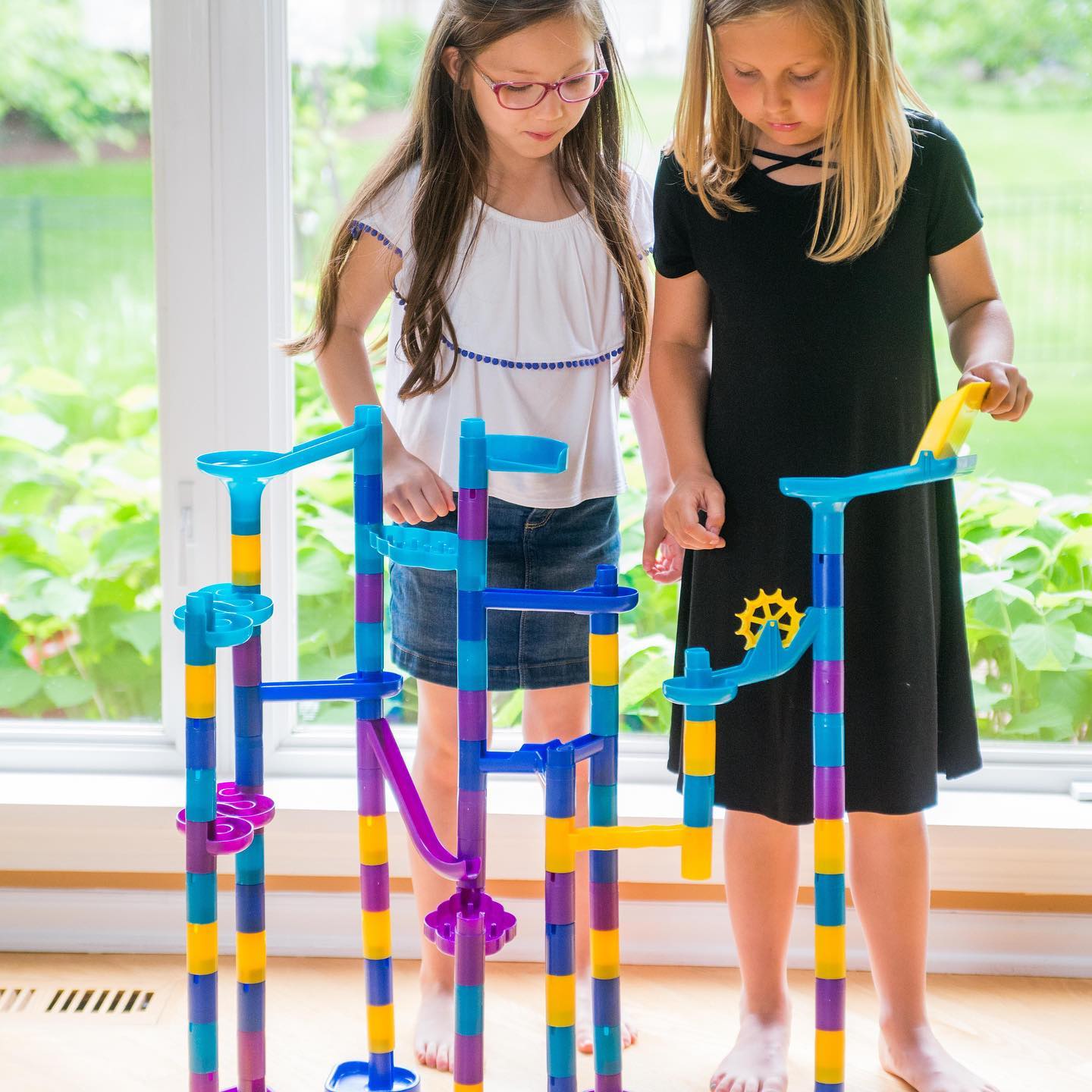 two girls playing with Marbleworks set